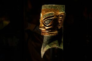 A close up of a mask on a pole