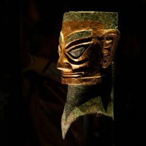 A close up of a mask on a pole