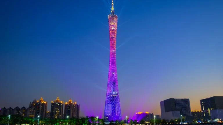 Guangzhou Canton Tower night view over Pearl River skyline with colorful lights